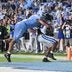 Nov 22, 2025; Chapel Hill, North Carolina, USA; Duke Blue Devils running back Nate Sheppard (20) scores with North Carolina Tar Heels defensive lineman Melkart Abou Jaoude (9) wrapped around him during the second half at Kenan Stadium.
