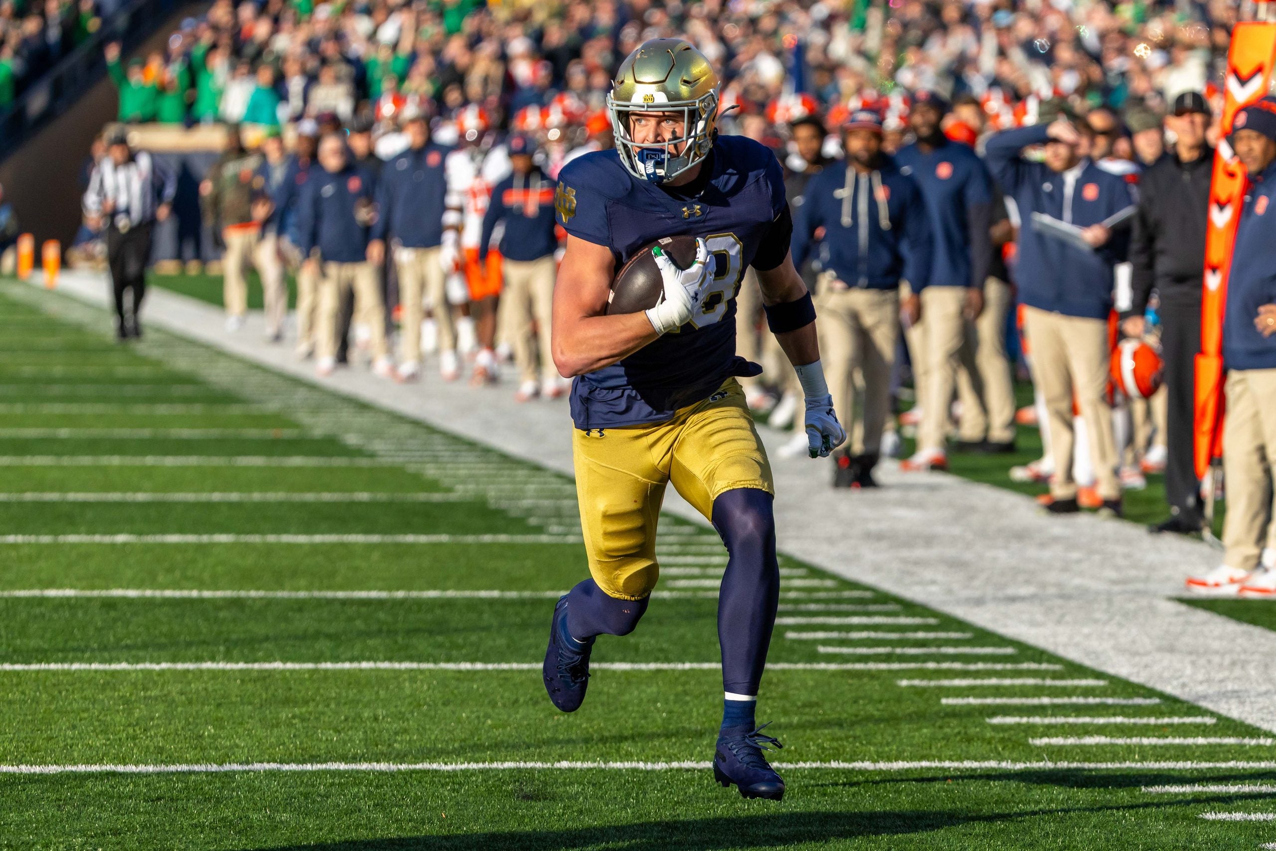 Nov 22, 2025; South Bend, Indiana, USA; Notre Dame Fighting Irish safety Luke Talich (28) returns a blocked kick for a touchdown against the Syracuse Orange during the first half at Notre Dame Stadium.