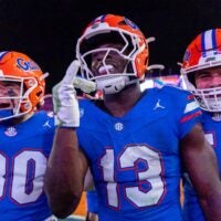 Nov 29, 2025; Gainesville, Florida, USA; Florida Gators running back Jadan Baugh (13) celebrates his touchdown during the fourth quarter against the Florida State Seminoles at Ben Hill Griffin Stadium.