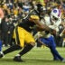 Nov 30, 2025; Pittsburgh, Pennsylvania, USA; Pittsburgh Steelers linebacker Malik Harrison (50) tackles Buffalo Bills running back James Cook III (4) during the second half at Acrisure Stadium.