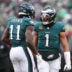 Dec 14, 2025; Philadelphia, Pennsylvania, USA; Philadelphia Eagles quarterback Jalen Hurts (1) reacts with wide receiver A.J. Brown (11) after their touchdown connection during the fourth quarter against the Las Vegas Raiders at Lincoln Financial Field.