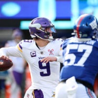 Dec 21, 2025; East Rutherford, New Jersey, USA; Minnesota Vikings quarterback J.J. McCarthy (9) drops back to pass against the New York Giants during the first half at MetLife Stadium.