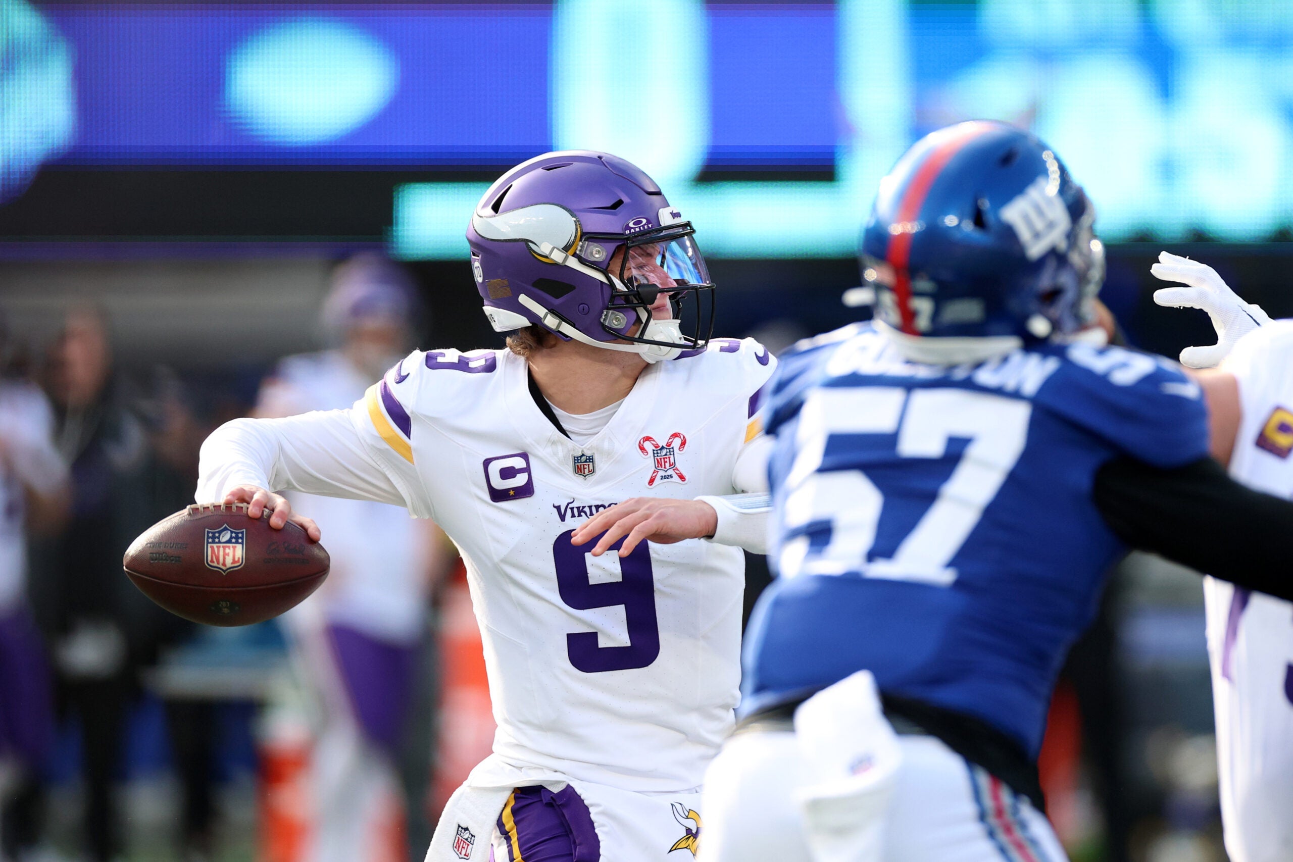 Dec 21, 2025; East Rutherford, New Jersey, USA; Minnesota Vikings quarterback J.J. McCarthy (9) drops back to pass against the New York Giants during the first half at MetLife Stadium.