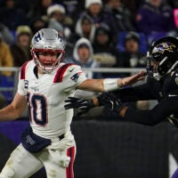 Dec 21, 2025; Baltimore, Maryland, USA; New England Patriots quarterback Drake Maye (10) runs from Baltimore Ravens linebacker Kyle van Noy (53) during the first half of the game at M&T Bank Stadium.