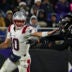 Dec 21, 2025; Baltimore, Maryland, USA; New England Patriots quarterback Drake Maye (10) runs from Baltimore Ravens linebacker Kyle van Noy (53) during the first half of the game at M&T Bank Stadium.
