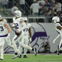 Dec 25, 2025; Minneapolis, Minnesota, USA; Minnesota Vikings safety Harrison Smith (22) celebrates after catching an interception against the Detroit Lions in the third quarter at U.S. Bank Stadium.