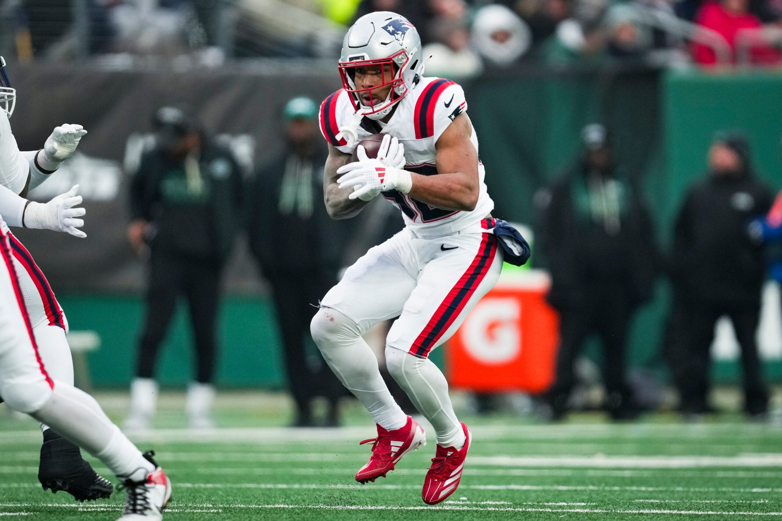 New England Patriots running back Treveyon Henderson (32) runs the ball during a game against the New York Jets at MetLife Stadium, Dec 28, 2025, East Rutherford, NJ, USA.