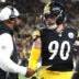 Jan 12, 2026; Pittsburgh, PA, USA; Pittsburgh Steelers head coach Mike Tomlin talks to linebacker T.J. Watt (90) during the first half of an AFC Wild Card Round against the Houston Texans game at Acrisure Stadium.