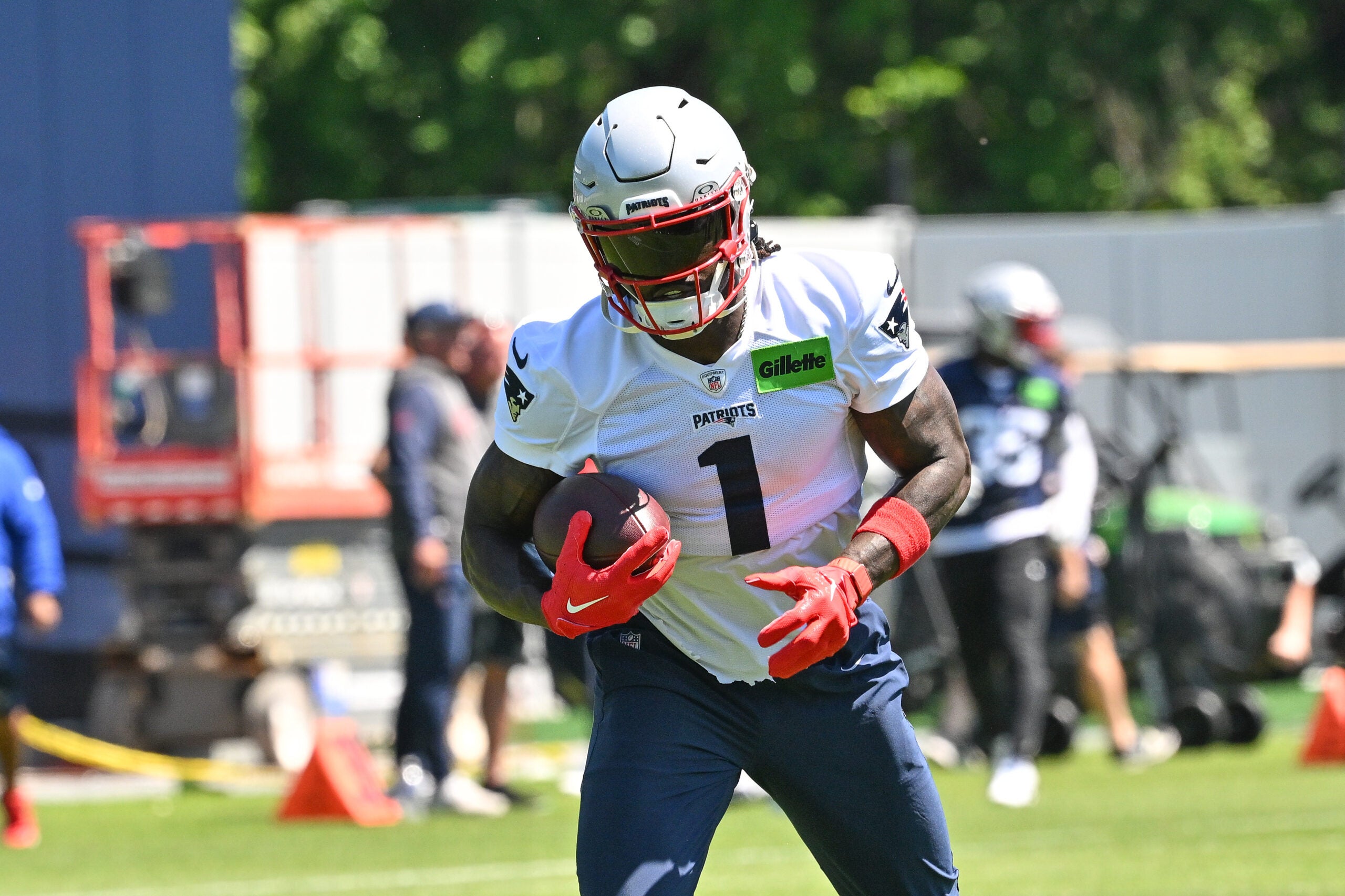 Jun 9, 2026; Foxborough, MA, USA; New England Patriots wide receiver A.J. Brown (1) runs after the catch at minicamp at Gillette Stadium.