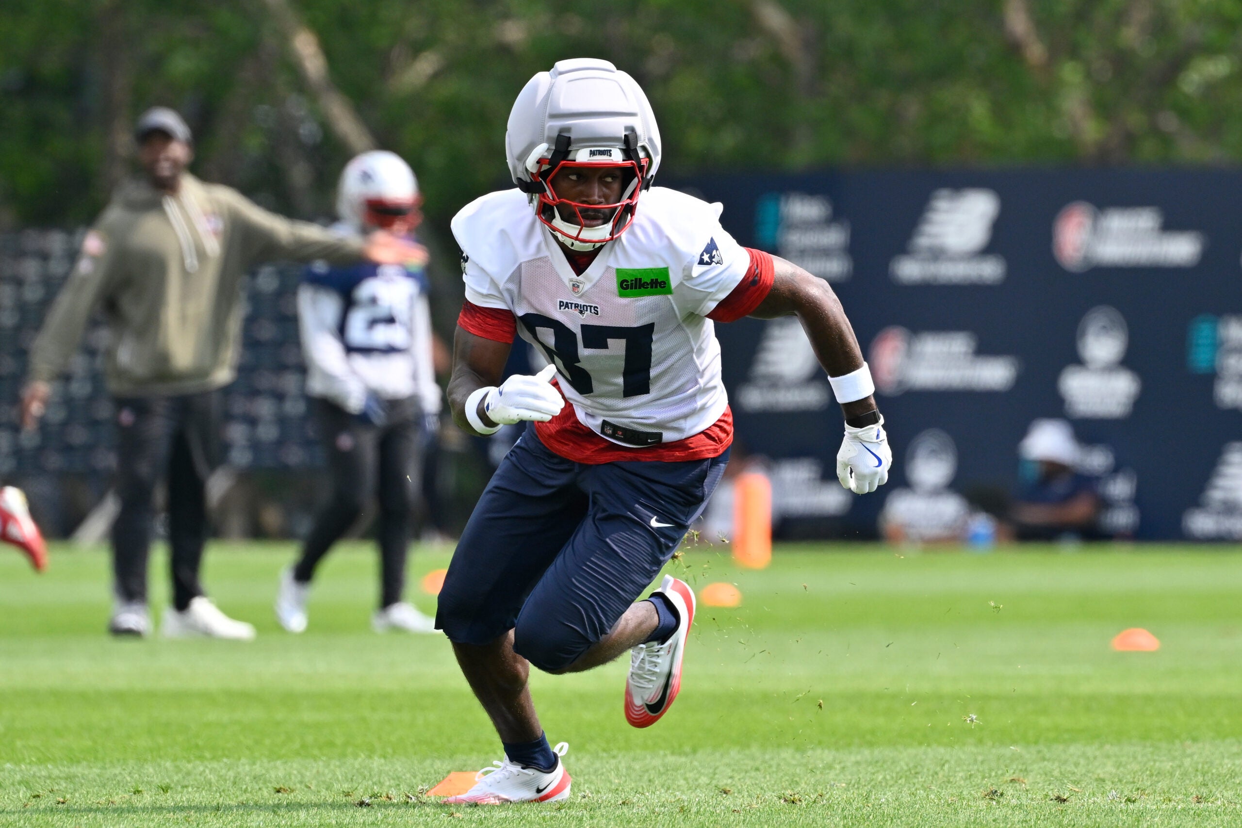 Jul 28, 2026; Foxborough, MA, USA; New England Patriots wide receiver Romeo Doubs (87) does a drill during training camp at Gillette Stadium.
