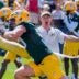Green Bay Packers defensive lineman Lukas Van Ness (90) runs through a drill during the first day of training camp at the Don Hutson Center on July 29.