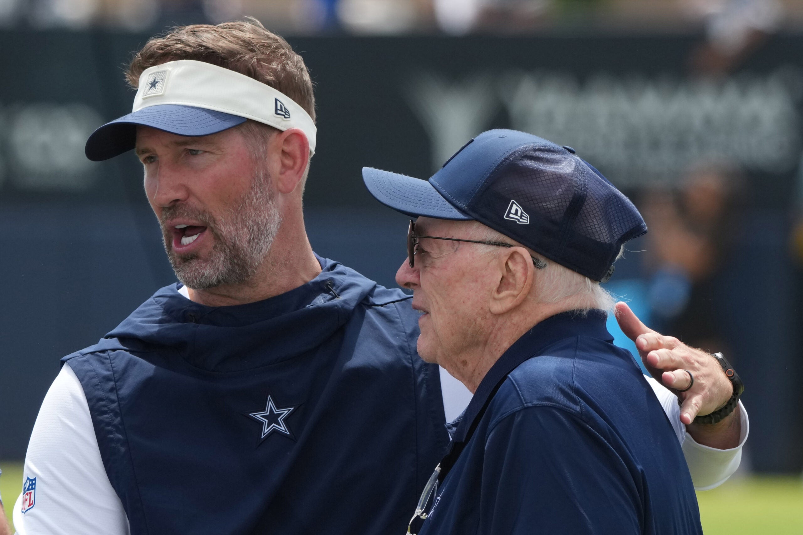 Jul 29, 2026; Oxnard, CA, USA; Dallas Cowboys coach Brian Schottenheimer (left) and owner Jerry Jones at training camp at River Ridge Playing Fields.