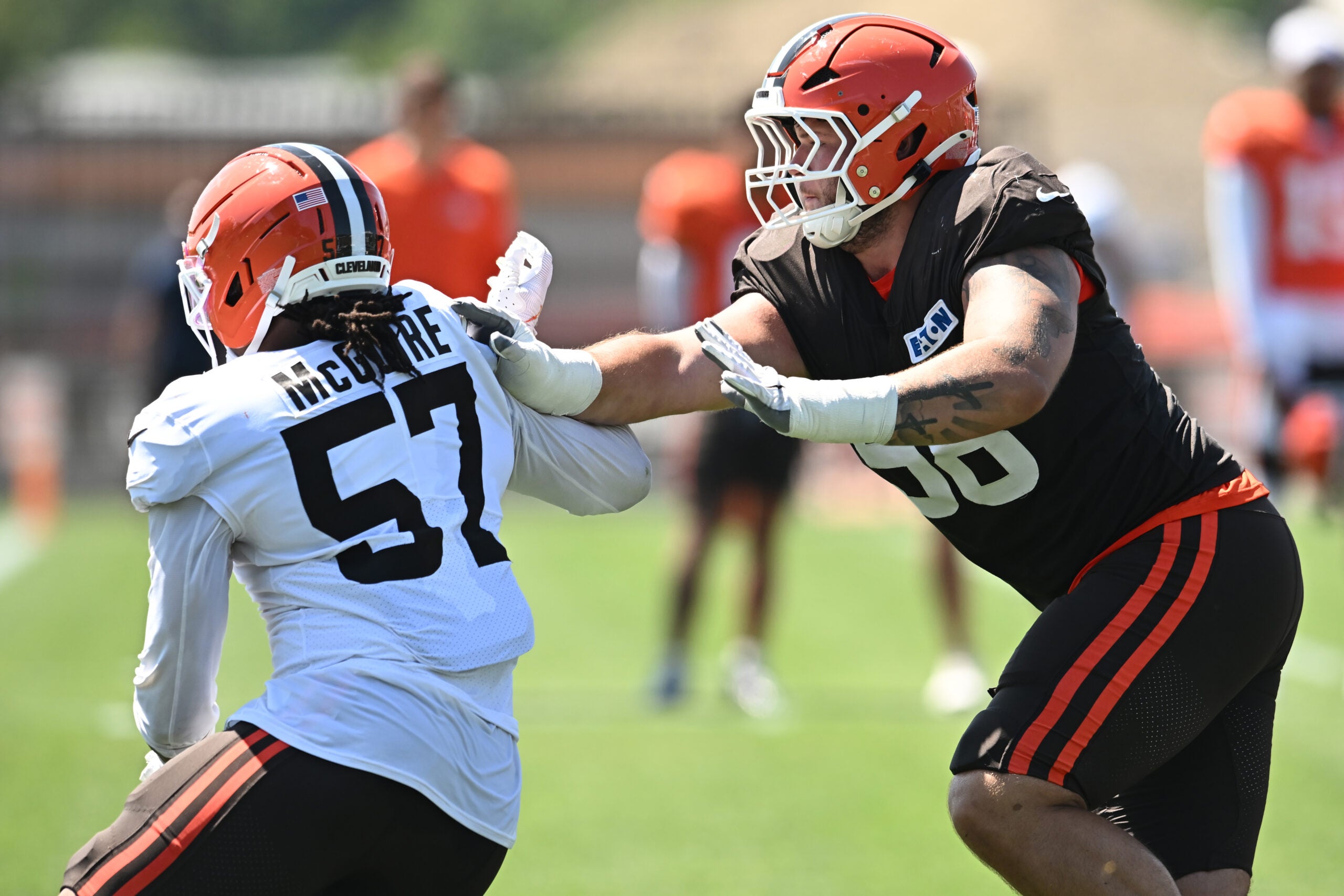 Aug 4, 2026; Berea, OH, USA; Cleveland Browns offensive tackle Austin Barber (58) blocks defensive end Isaiah McGuire (57) during training camp at CrossCountry Mortgage Campus.