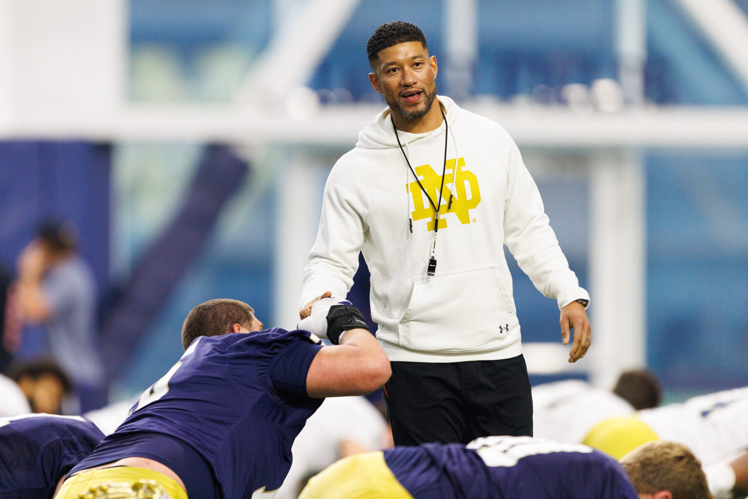 Head coach Marcus Freeman greets his players during a Notre Dame football practice at Irish Athletic Center on Friday, March 20, 2026, in South Bend.