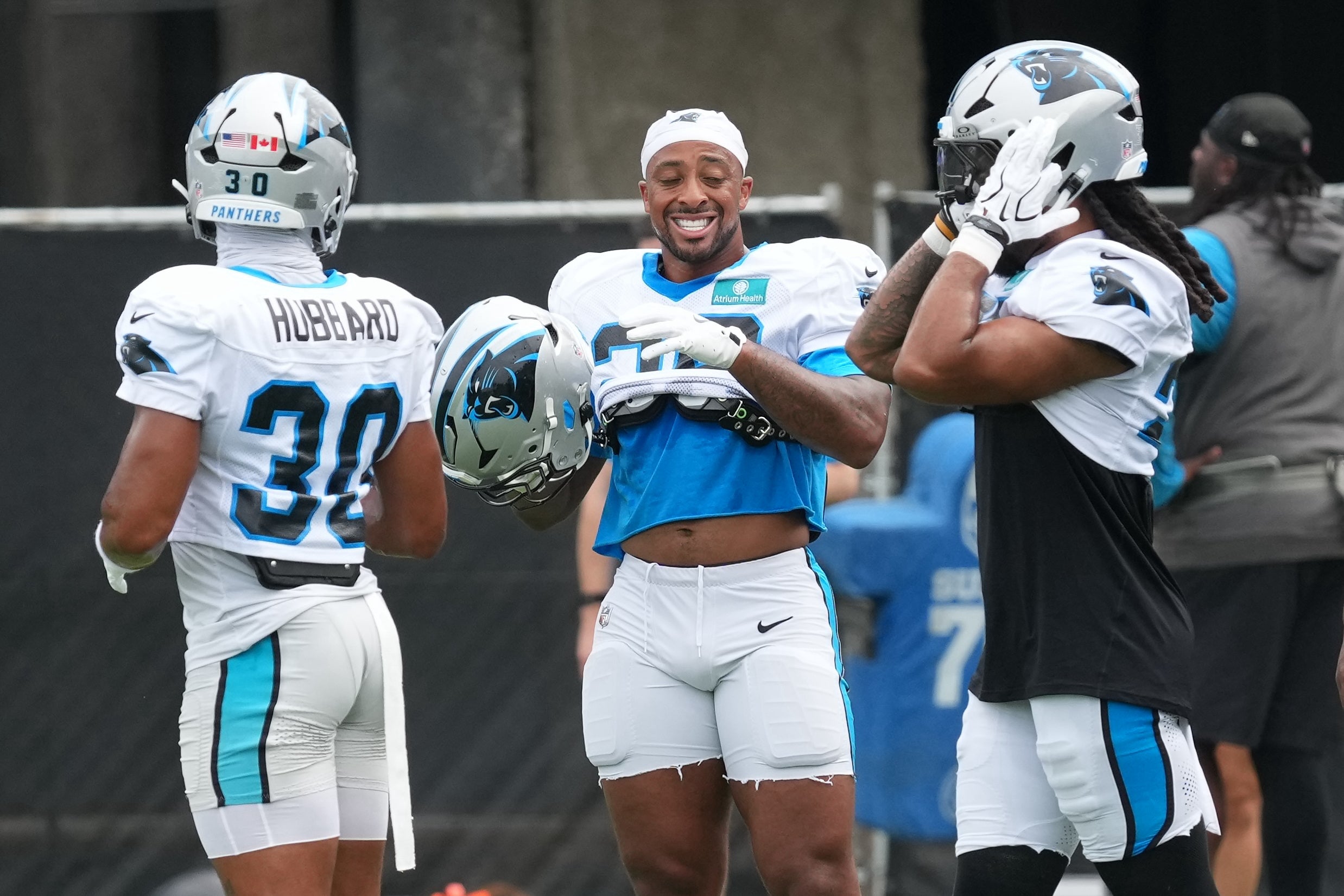 Aug 4, 2026; Charlotte, NC, USA; Carolina Panthers running back Chuba Hubbard (30), running back AJ Dillon (28) and running back Jonathon Brooks (25) during training camp at Bank of America Stadium.