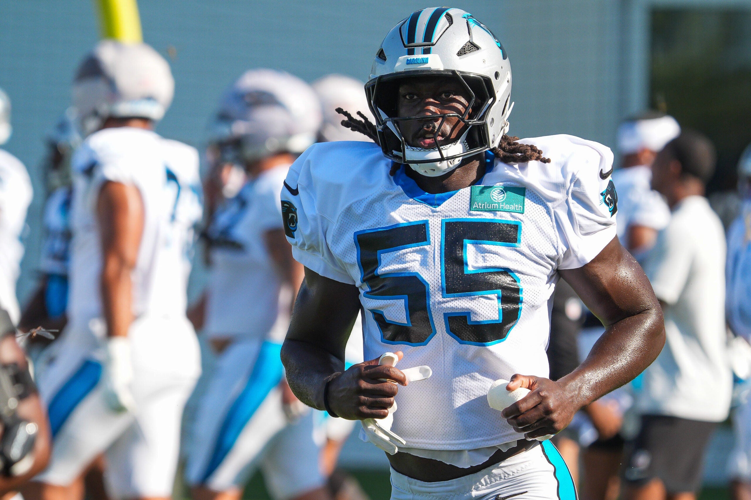 Carolina Panthers linebacker Devin Lloyd (55) jogs onto the field during a joint practice with the Carolina Panthers on the 16th session of NFL training camp at the Miller Electric Center on Wednesday, Aug. 19, 2026, in Jacksonville, Fla.