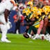Aug 21, 2026; Denver, Colorado, USA; Green Bay Packers center Jager Burton (52) lines up for a snap in the second quarter of a preseason game against the Denver Broncos at Empower Field at Mile High.