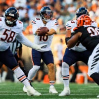 Aug 22, 2026; Cincinnati, Ohio, USA; Chicago Bears quarterback Caleb Williams (18) snaps the ball against the Cincinnati Bengals in the first half at Paycor Stadium.