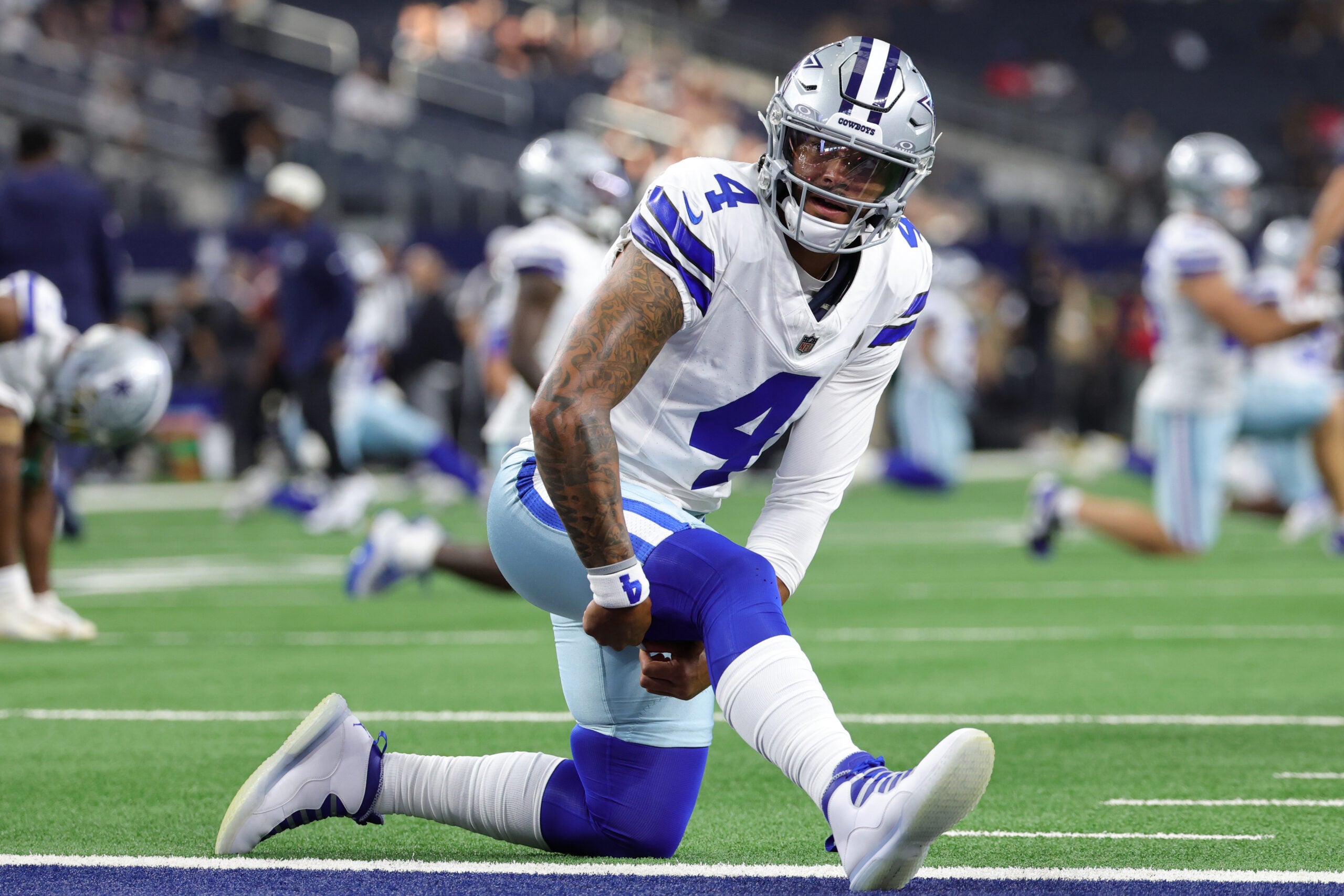 Aug 28, 2026; Arlington, Texas, USA; Dallas Cowboys quarterback Dak Prescott (4) warms up before the game against the New Orleans Saints at AT&T Stadium.