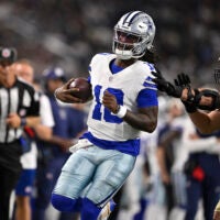 Aug 28, 2026; Arlington, Texas, USA; Dallas Cowboys quarterback Joe Milton III (10) is pushed out of bounds by New Orleans Saints linebacker Danny Stutsman (28) in the first quarter at AT&T Stadium.