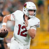 Aug 28, 2026; Green Bay, Wisconsin, USA; Arizona Cardinals quarterback Kedon Slovis (12) looks to throw a pass during the second quarter against the Green Bay Packers at Lambeau Field.