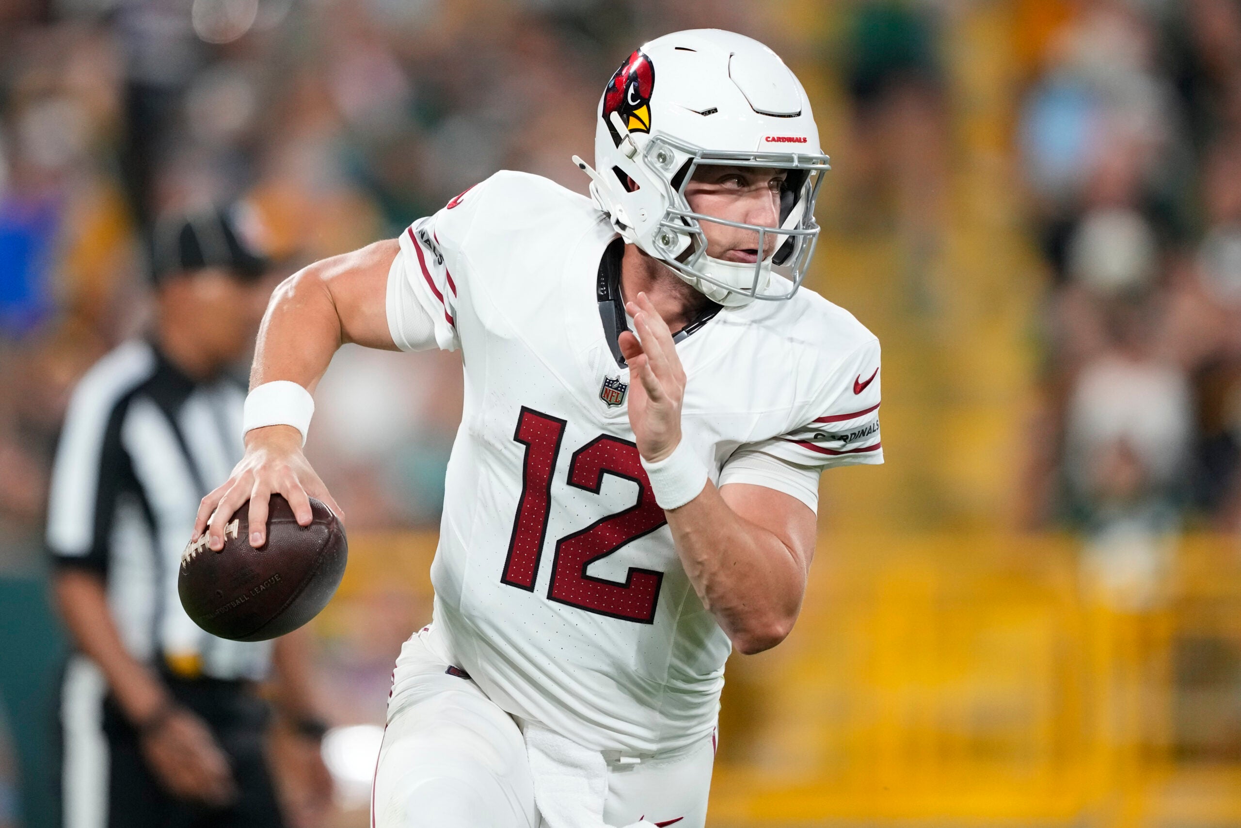 Aug 28, 2026; Green Bay, Wisconsin, USA; Arizona Cardinals quarterback Kedon Slovis (12) looks to throw a pass during the second quarter against the Green Bay Packers at Lambeau Field.
