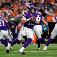 Aug 28, 2026; Denver, Colorado, USA; Minnesota Vikings quarterback Max Brosmer (12) looks to pass in the second quarter against the Denver Broncos at Empower Field at Mile High.