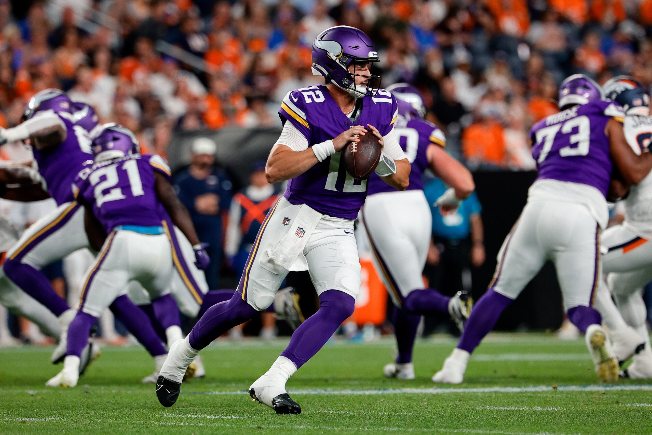 Aug 28, 2026; Denver, Colorado, USA; Minnesota Vikings quarterback Max Brosmer (12) looks to pass in the second quarter against the Denver Broncos at Empower Field at Mile High.