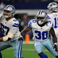Aug 28, 2026; Arlington, Texas, USA; Dallas Cowboys offensive tackle Drew Shelton (67) and running back Israel Abanikanda (30) block during the game between the Cowboys and the Saints at AT&T Stadium.