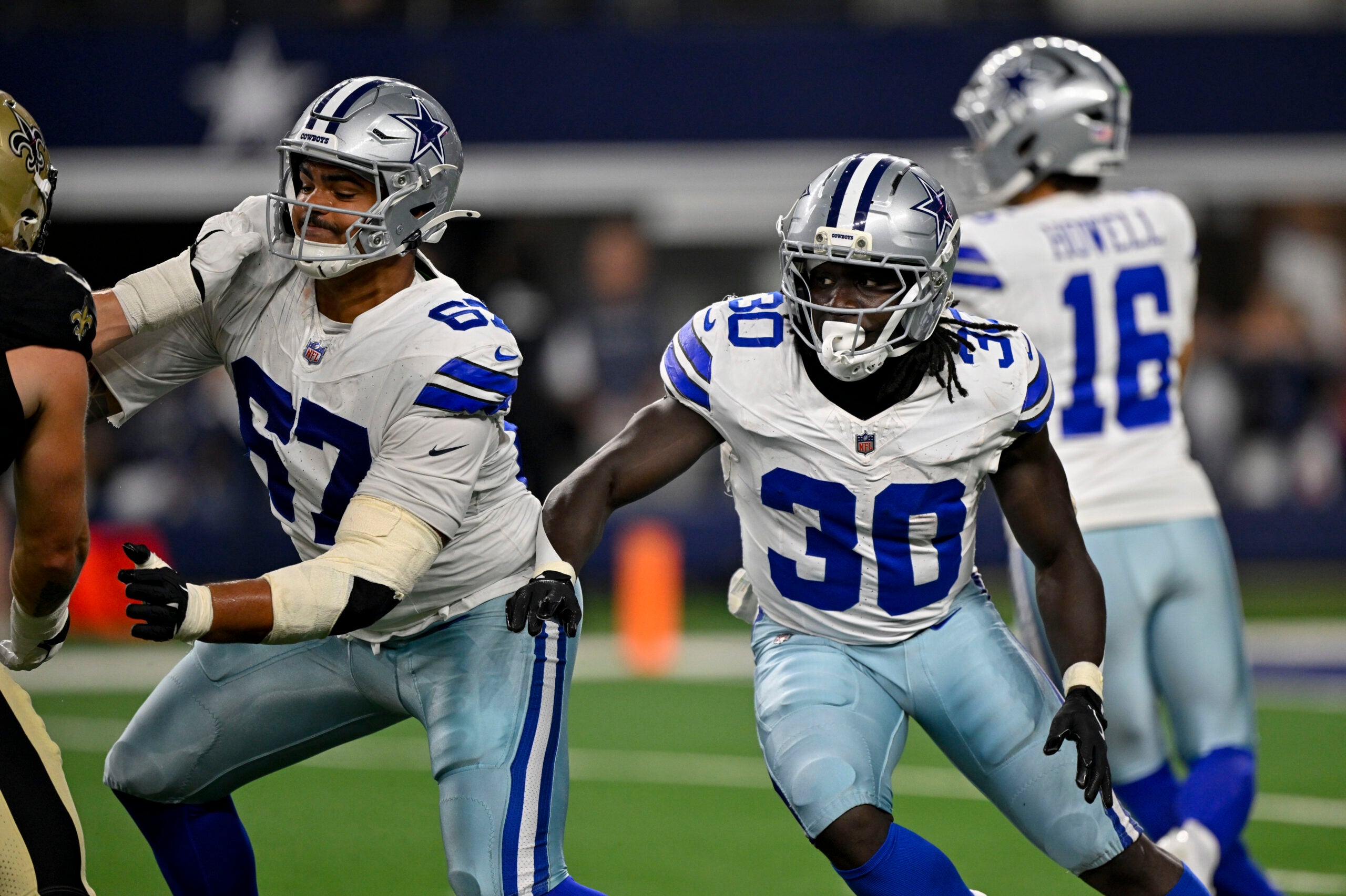 Aug 28, 2026; Arlington, Texas, USA; Dallas Cowboys offensive tackle Drew Shelton (67) and running back Israel Abanikanda (30) block during the game between the Cowboys and the Saints at AT&T Stadium.