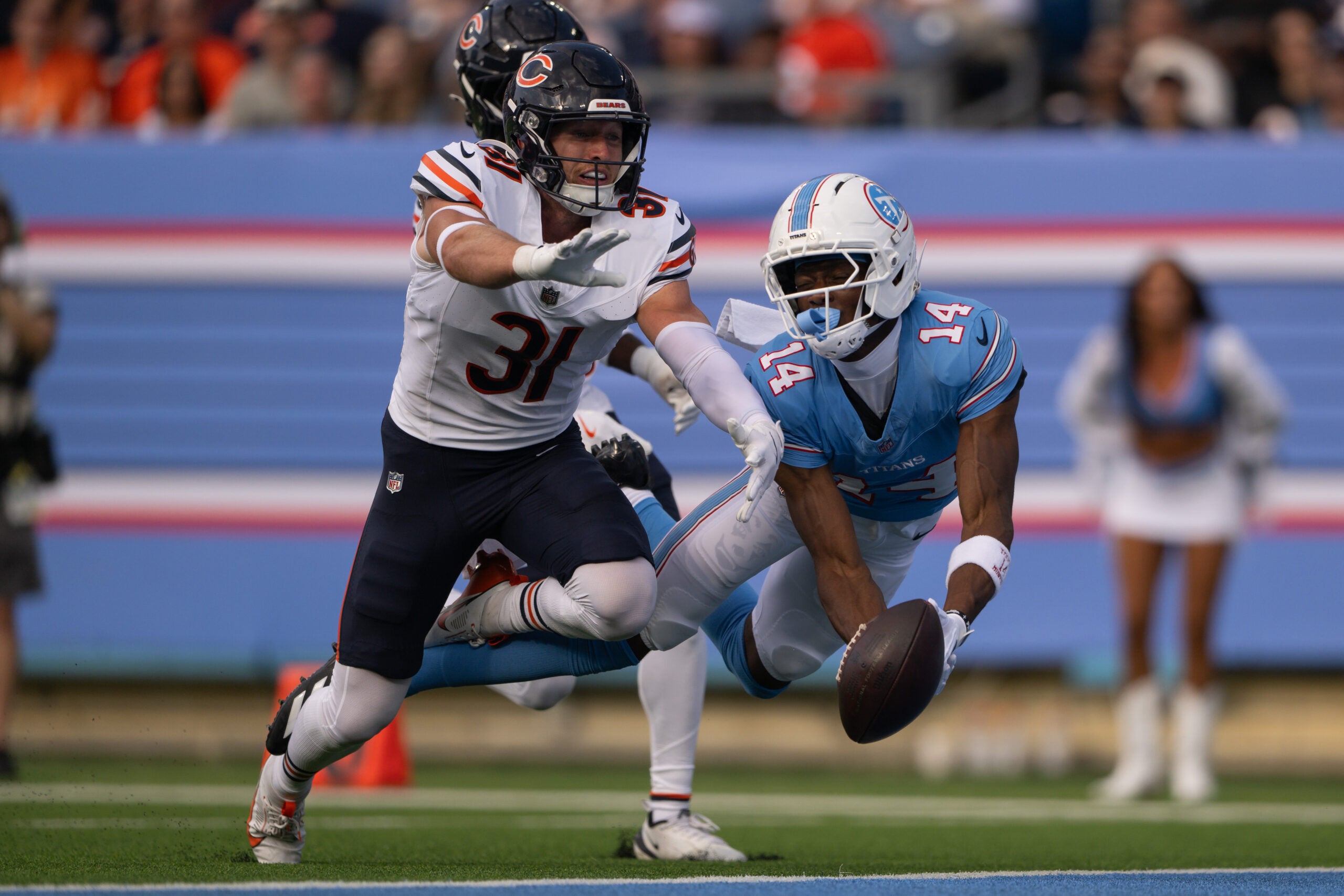 Aug 29, 2026; Nashville, Tennessee, USA; Chicago Bears safety Dillon Thieneman (31) breaks up pass thrown to Tennessee Titans wider receiver Carnell Tate (14) during the first half at Nissan Stadium.