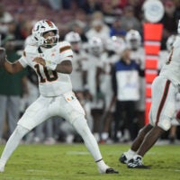 Sep 4, 2026; Stanford, California, USA; Miami Hurricanes quarterback Darian Mensah (10) throws downfield against the Stanford Cardinal during the third quarter at Stanford Stadium.