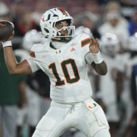 Sep 4, 2026; Stanford, California, USA; Miami Hurricanes quarterback Darian Mensah (10) stands in the pocket against the Stanford Cardinal during the third quarter at Stanford Stadium.