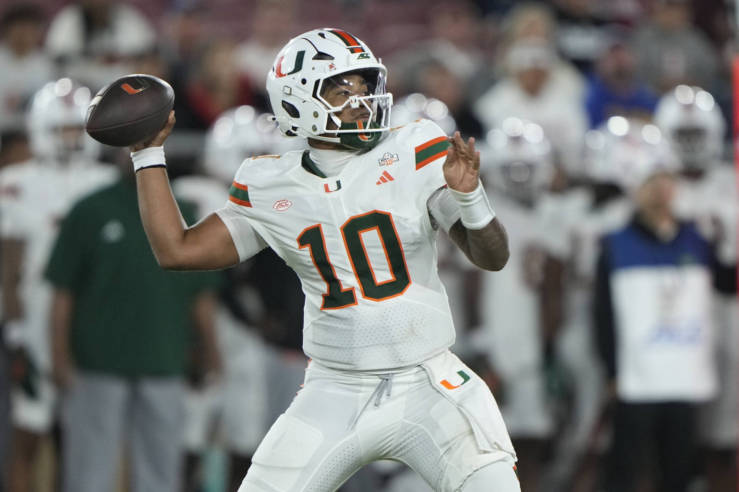 Sep 4, 2026; Stanford, California, USA; Miami Hurricanes quarterback Darian Mensah (10) stands in the pocket against the Stanford Cardinal during the third quarter at Stanford Stadium.