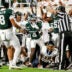 Michigan States Charles Brantley, center, looks to see if referees grant him an interception on a play against Toledos Daryl Barnett Jr. during the second quarter on Friday, Sept. 4, 2026, at Spartan Stadium in East Lansing.