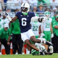 Sep 5, 2026; University Park, Pennsylvania, USA; Penn State Nittany Lions wide receiver Koby Howard (6) runs with the ball while avoiding a tackle from Marshall Thundering Herd defensive back Caleb Clark-Glover (0) during the first quarter at West Shore Home Field at Beaver Stadium.