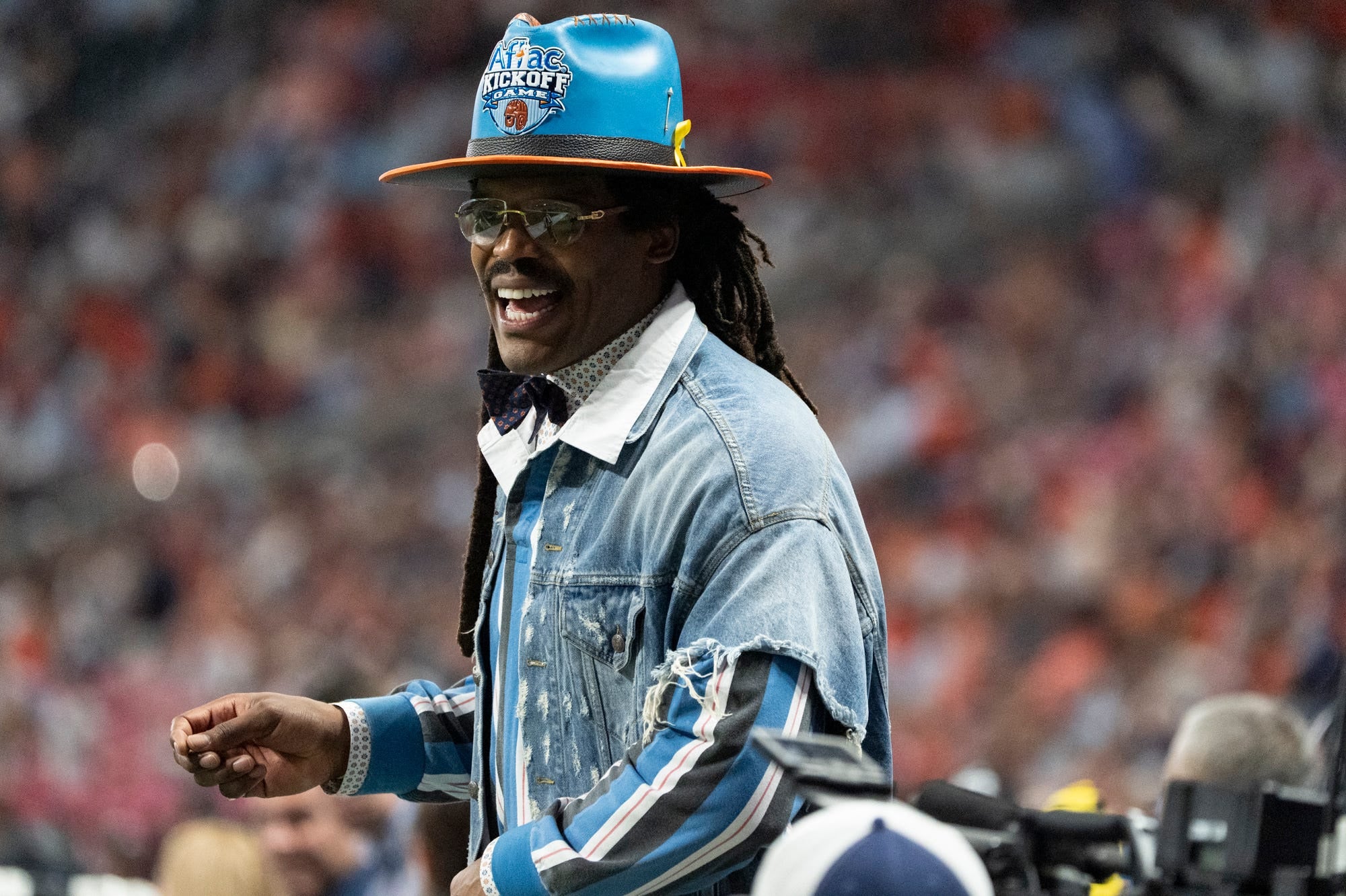 Former Auburn Tigers and NFL player Cam Newton joins the sideline as Auburn Tigers take on Baylor Bears in the Aflac Kickoff Game at Mercedes-Benz Stadium in Atlanta, Ga. on Saturday, Sept. 5, 2026. Auburn Tigers defeated Baylor Bears 17-16.