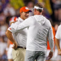 Sep 5, 2026; Baton Rouge, Louisiana, USA; LSU Tigers head coach Lane Kiffin talks with Clemson Tigers head coach Dabo Swinney at Tiger Stadium.
