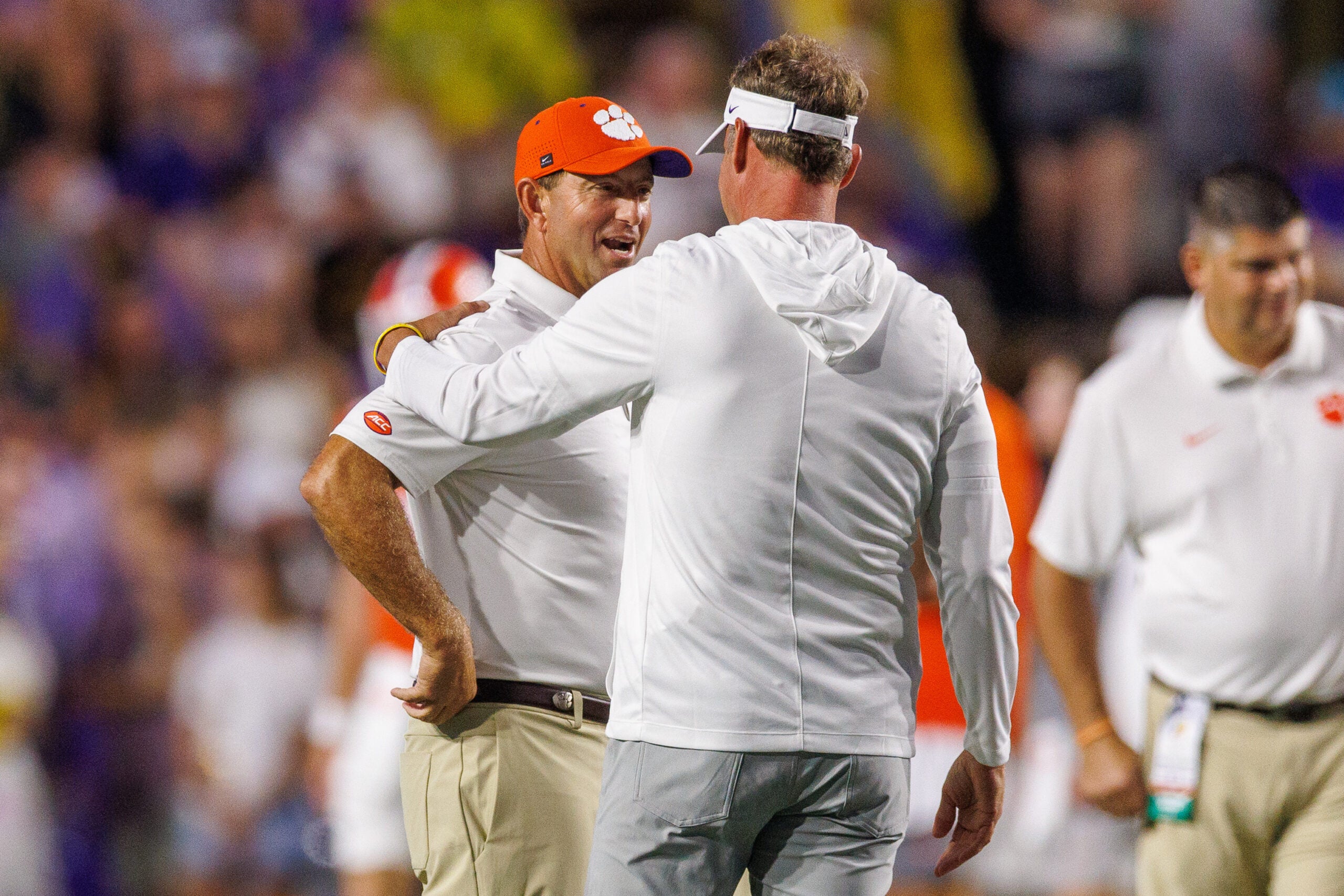Sep 5, 2026; Baton Rouge, Louisiana, USA; LSU Tigers head coach Lane Kiffin talks with Clemson Tigers head coach Dabo Swinney at Tiger Stadium.
