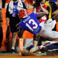 Sep 5, 2026; Gainesville, Florida, USA; Florida Gators running back Jadan Baugh (13) scores a touchdown against the Florida Atlantic Owls during the first half at Ben Hill Griffin Stadium.