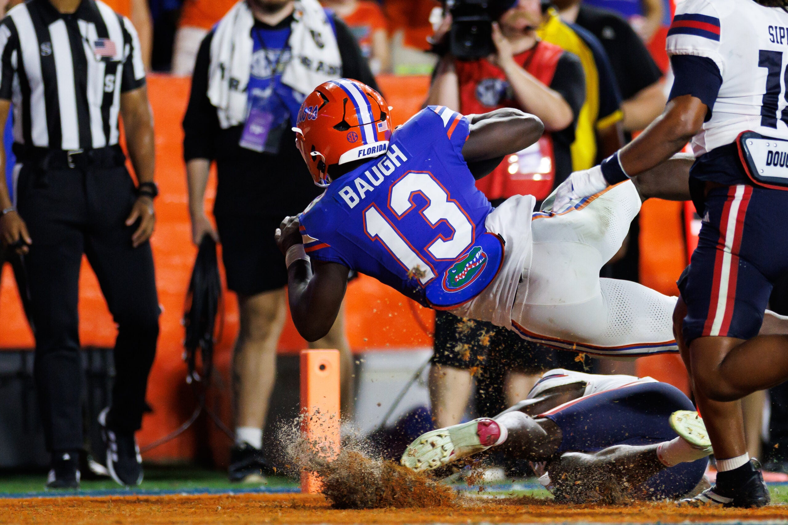 Sep 5, 2026; Gainesville, Florida, USA; Florida Gators running back Jadan Baugh (13) scores a touchdown against the Florida Atlantic Owls during the first half at Ben Hill Griffin Stadium.