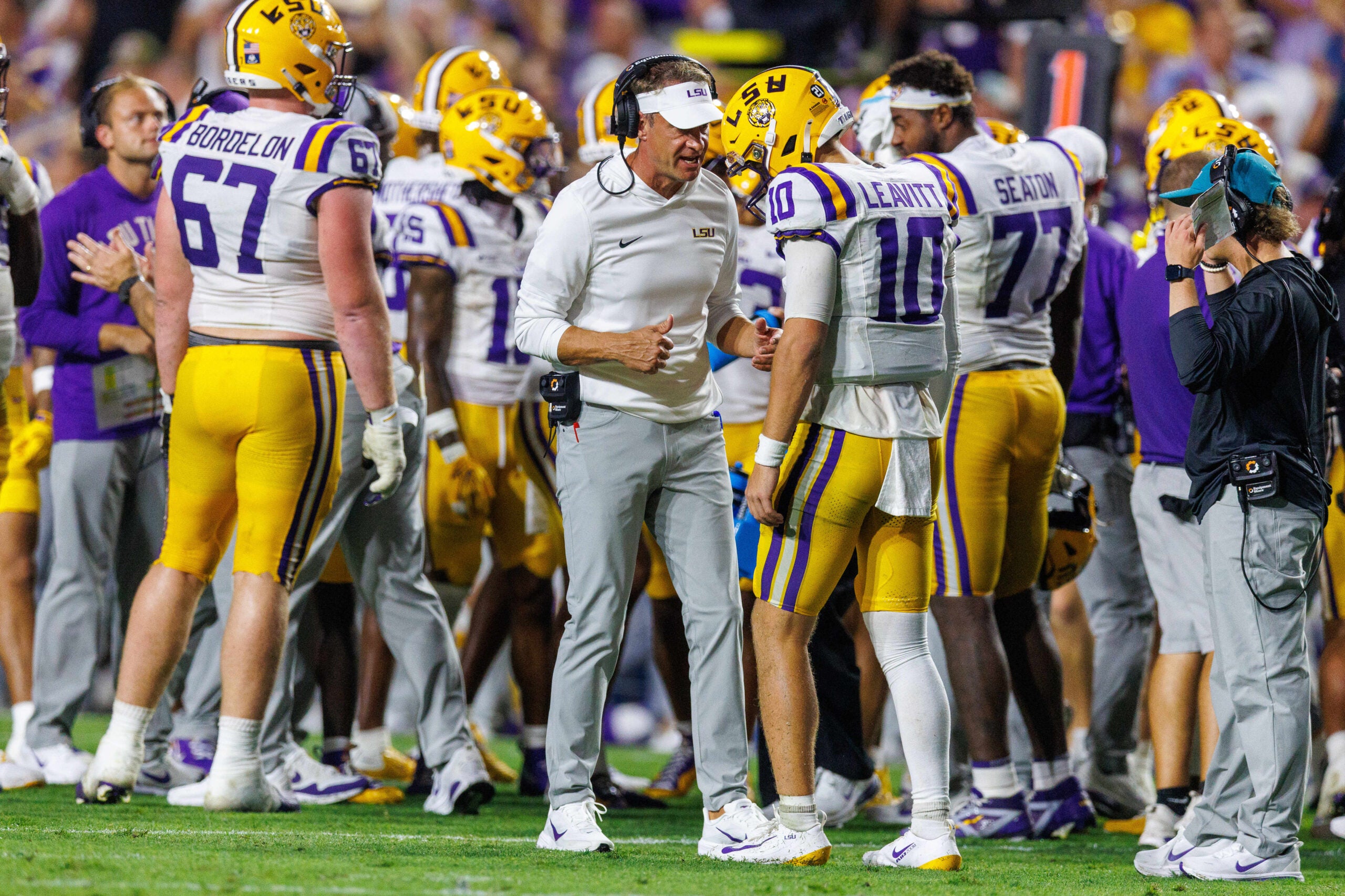 Sep 5, 2026; Baton Rouge, Louisiana, USA; LSU Tigers head coach Lane Kiffin talks to quarterback Sam Leavitt (10) against Clemson Tigers during the first half at Tiger Stadium.