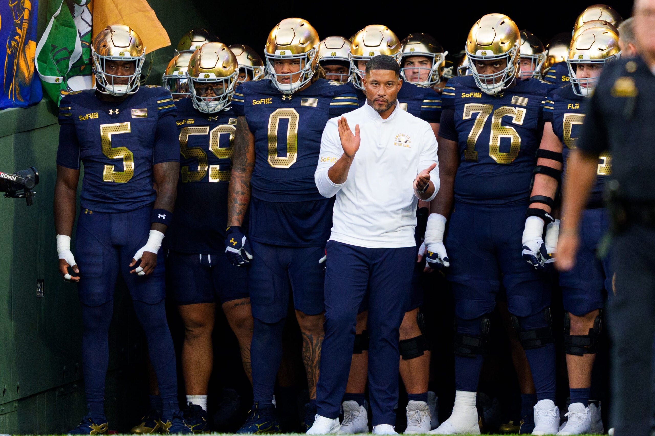 Notre Dame head coach Marcus Freeman prepares to take the field with his team before a NCAA football game against Wisconsin at Lambeau Field on Sunday, Sept. 6, 2026, in Green Bay, WI.
