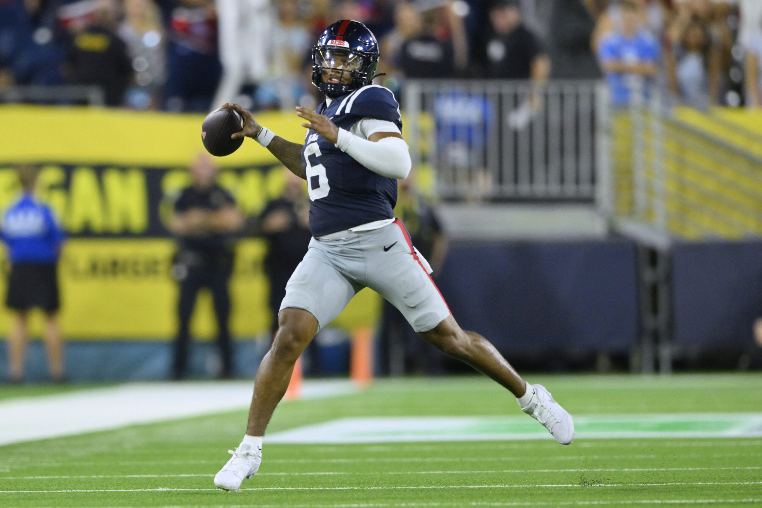 Sep 6, 2026; Nashville, Tennessee, USA; Mississippi Rebels quarterback Trinidad Chambliss (6) passes the ball down field against the Louisville Cardinals during the fourth quarter at Nissan Stadium.