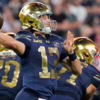 Notre Dame quarterback CJ Carr (13) passes the ball against Wisconsin on Sunday, Sept. 6, 2026, at Lambeau Field in Green Bay, Wisconsin. Notre Dame won the game, 41-13.