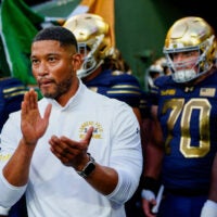 Notre Dame head coach Marcus Freeman waits to take the field with his team before a game against Wisconsin on Sunday, Sept. 6, 2026, at Lambeau Field in Green Bay, Wisconsin. Notre Dame won the game, 41-13.