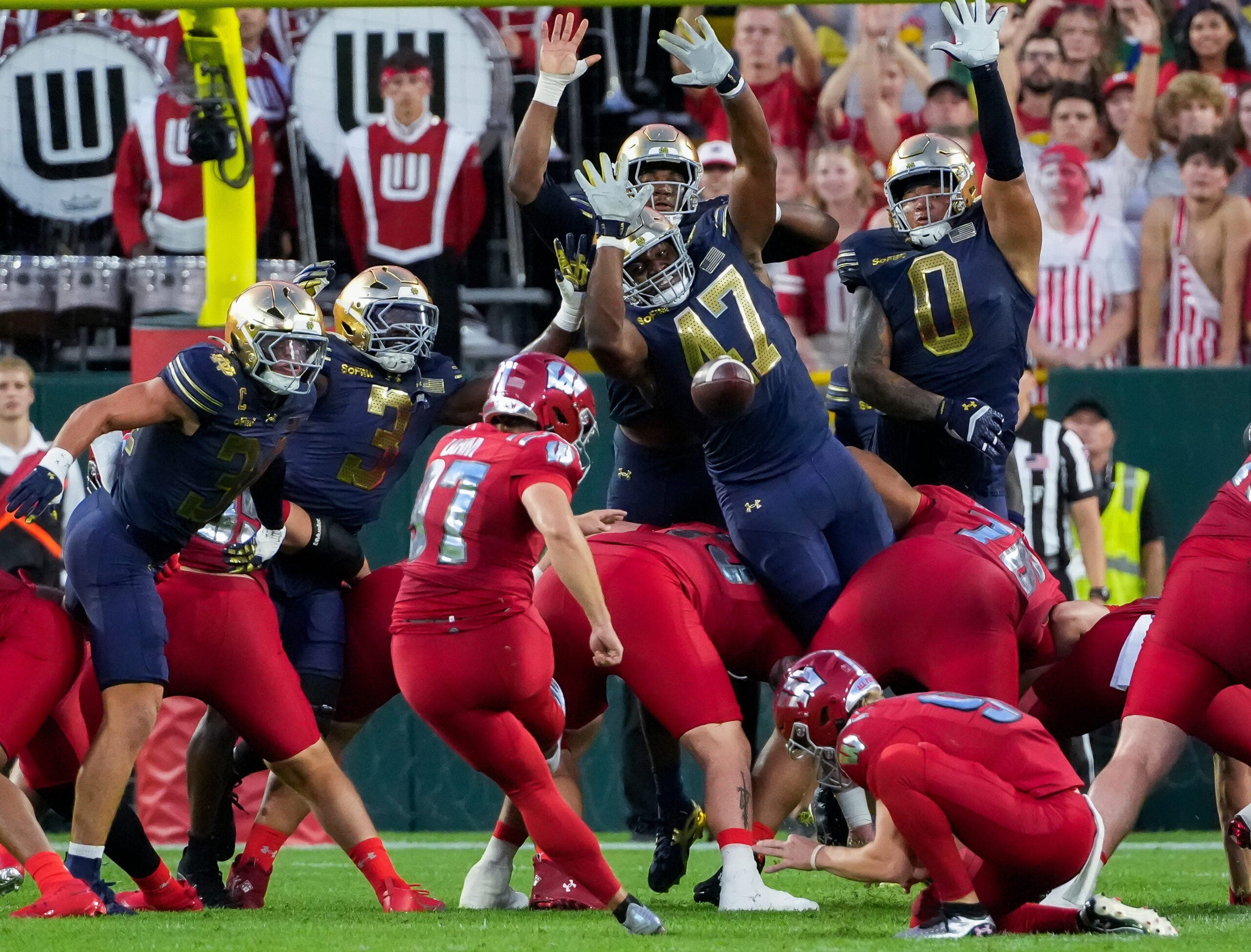 Notre Dame defensive lineman Jason Onye (47) and defensive lineman Tionne Gray (0) try to block a field goal by Wisconsin place kicker Gavin Lahm (97) on Sunday, Sept. 6, 2026, at Lambeau Field in Green Bay, Wisconsin. Notre Dame won the game, 41-13.