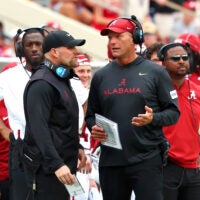 Sep 5, 2026; Tuscaloosa, Alabama, USA; Alabama Crimson Tide head coach Kalen DeBoer (right) talks with an assistant during the second quarter against the East Carolina Pirates at Saban Field at Bryant-Denny Stadium.