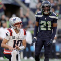 Sep 9, 2026; Seattle, Washington, USA; Seattle Seahawks cornerback Devon Witherspoon (21) reacts after pressuring New England Patriots quarterback Drake Maye (10) during the first quarter at Lumen Field.