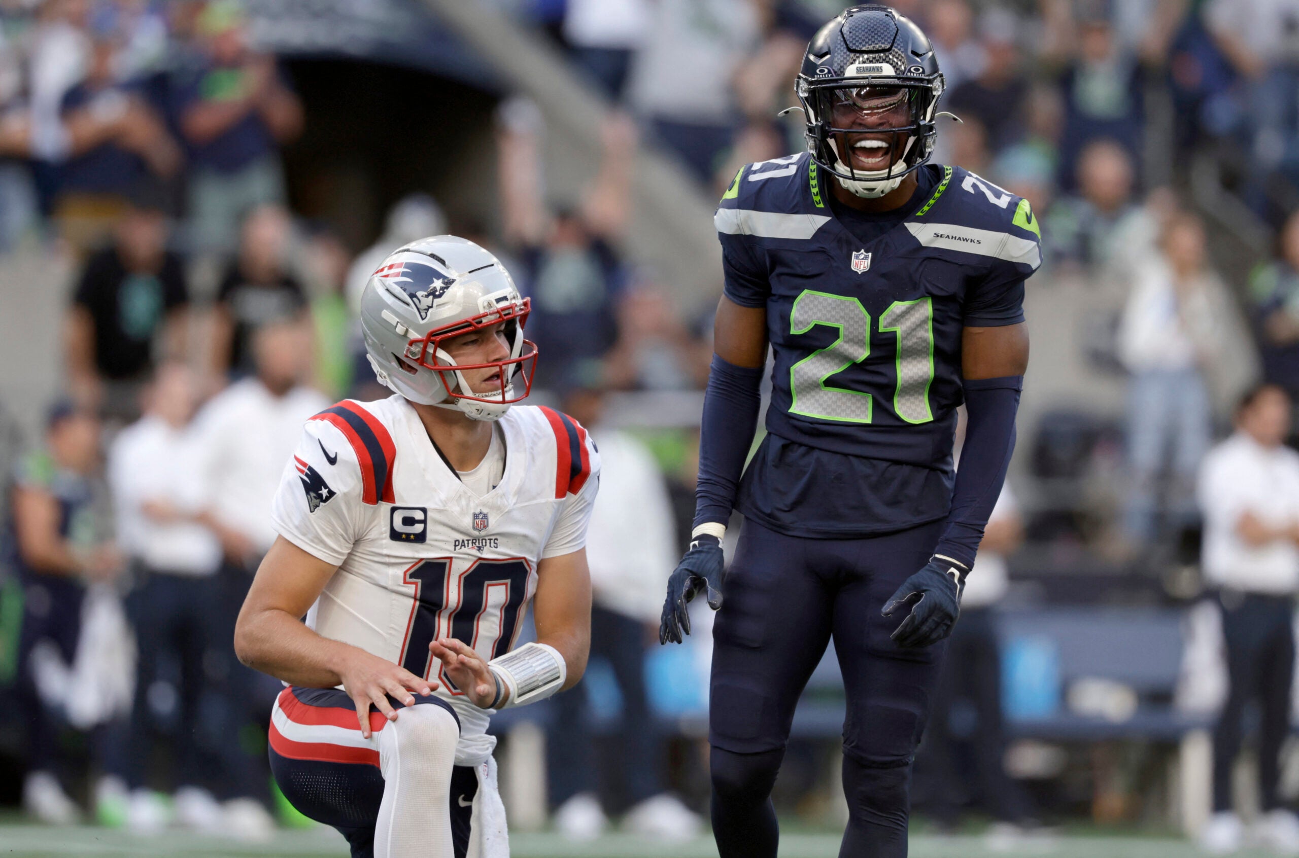 Sep 9, 2026; Seattle, Washington, USA; Seattle Seahawks cornerback Devon Witherspoon (21) reacts after pressuring New England Patriots quarterback Drake Maye (10) during the first quarter at Lumen Field.